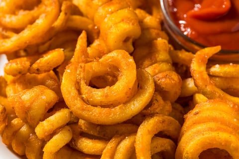 Seasoned Homemade Curly French Fries with Ketchup