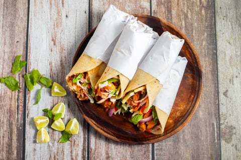 Chicken shawarma roll is a Middle Eastern wrap made with spiced grilled chicken, garlic sauce, pickled veggies, and flatbread