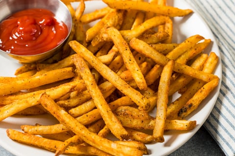 Homemade Spicy Seasoned French Fries with Ketchup on a Plate